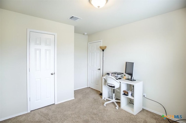 home office featuring baseboards, visible vents, and carpet flooring