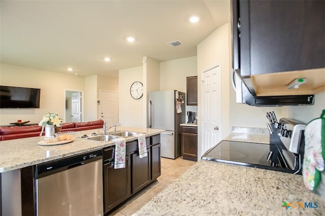 kitchen featuring a sink, open floor plan, light tile patterned floors, appliances with stainless steel finishes, and visible vents