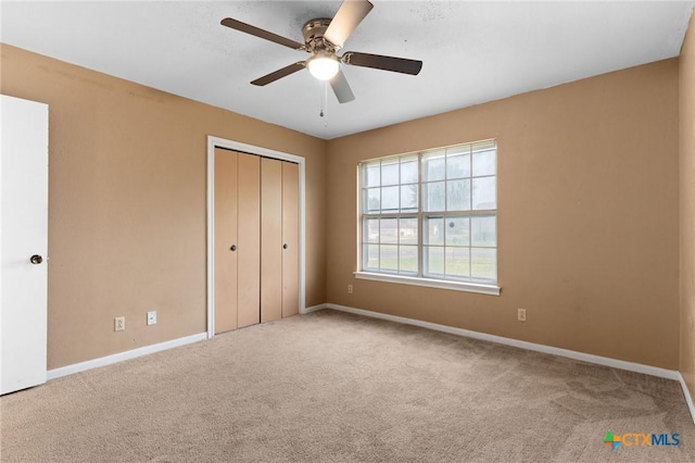 2301 Dover Rd, Killeen, TX 76543 - unfurnished bedroom with baseboards, carpet, a closet, and a ceiling fan