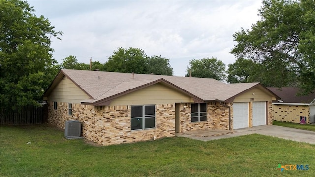 2301 Dover Rd, Killeen, TX 76543 - ranch-style home with central air condition unit, a garage, driveway, and a front yard