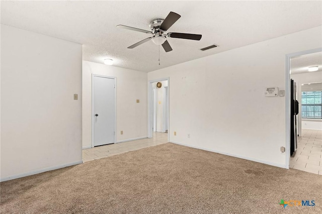 2301 Dover Rd, Killeen, TX 76543 - empty room featuring light carpet, a ceiling fan, and baseboards