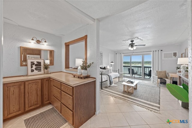 2 Cliffhouse Dr Unit 103, Belton, TX 76513 - bathroom with a textured ceiling, tile patterned flooring, a ceiling fan, and a water view