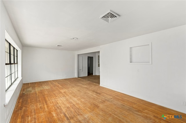 unfurnished room featuring wood-type flooring