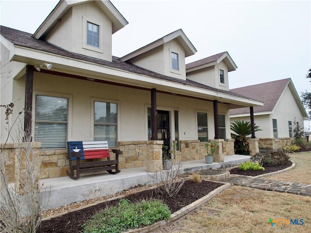 view of front of property featuring covered porch