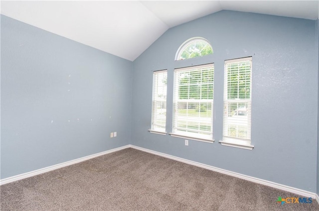 5204 Southern Crossing Dr, Temple, TX 76502 - carpeted empty room with lofted ceiling and baseboards