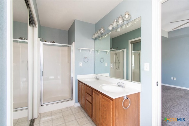 5204 Southern Crossing Dr, Temple, TX 76502 - full bathroom with a stall shower, double vanity, and a ceiling fan