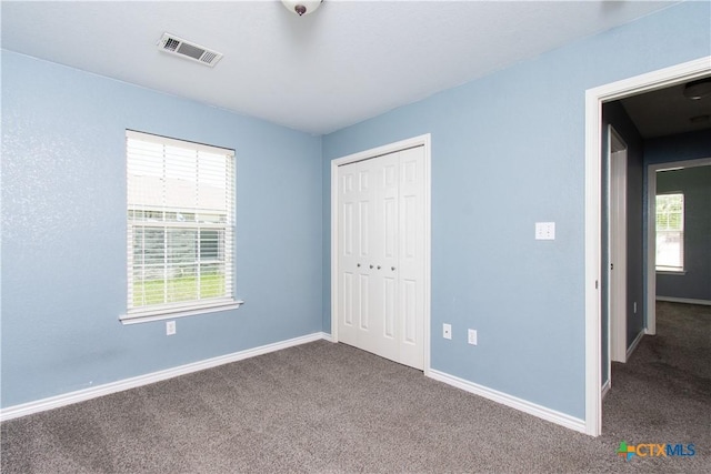 5204 Southern Crossing Dr, Temple, TX 76502 - unfurnished bedroom with carpet, baseboards, and a closet
