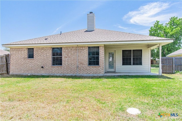 5204 Southern Crossing Dr, Temple, TX 76502 - back of property featuring a patio area, a chimney, brick siding, and roof with shingles