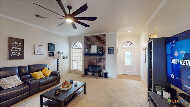 carpeted living room featuring ceiling fan, a fireplace, and ornamental molding