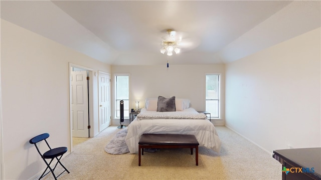 bedroom featuring light colored carpet and ceiling fan