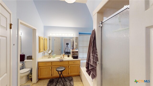 bathroom featuring vanity, an enclosed shower, vaulted ceiling, and toilet