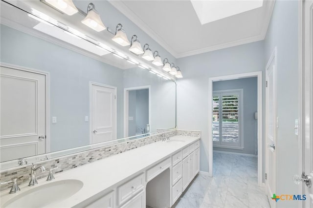 6013 Country Club Dr, Victoria, TX 77904 - bathroom featuring double vanity, marble finish floors, crown molding, and a skylight