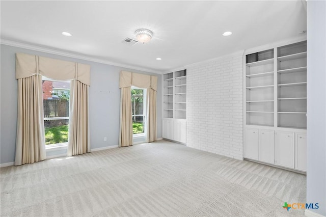 6013 Country Club Dr, Victoria, TX 77904 - carpeted spare room with built in shelves, recessed lighting, and ornamental molding