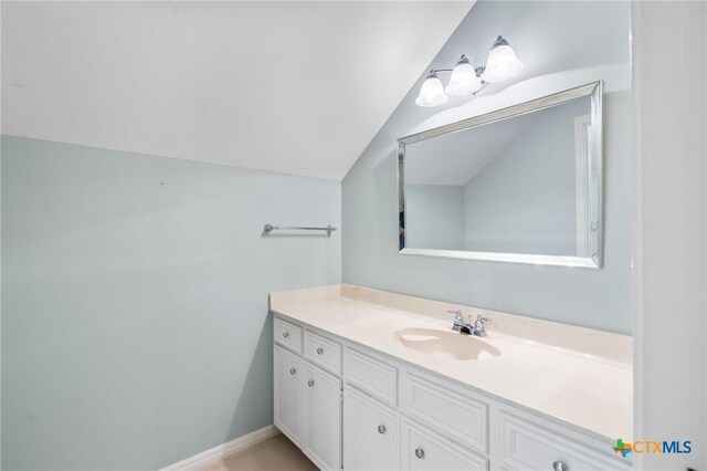 6013 Country Club Dr, Victoria, TX 77904 - bathroom with lofted ceiling and vanity