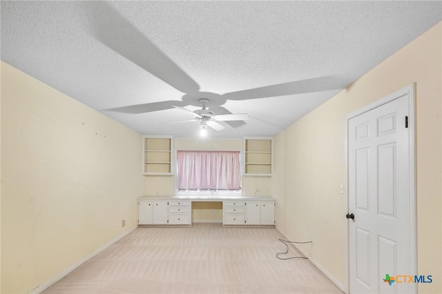 6013 Country Club Dr, Victoria, TX 77904 - unfurnished office featuring a ceiling fan, light carpet, a textured ceiling, and built in desk