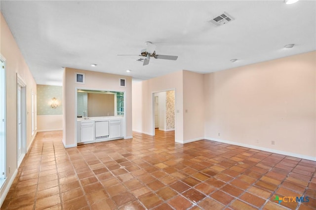 6013 Country Club Dr, Victoria, TX 77904 - unfurnished living room with a ceiling fan, recessed lighting, and light tile patterned floors