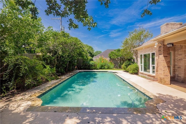 6013 Country Club Dr, Victoria, TX 77904 - view of pool with a fenced backyard and a patio
