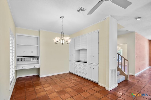 6013 Country Club Dr, Victoria, TX 77904 - kitchen featuring a chandelier, white cabinetry, plenty of natural light, and ornamental molding