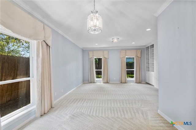 6013 Country Club Dr, Victoria, TX 77904 - carpeted spare room with a chandelier, ornamental molding, recessed lighting, and built in shelves