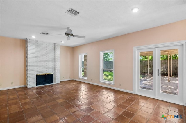 6013 Country Club Dr, Victoria, TX 77904 - unfurnished living room with a ceiling fan, recessed lighting, a brick fireplace, and french doors