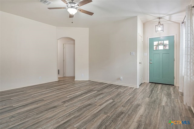 506 Old Peak Rd, Georgetown, TX 78626 - entryway featuring arched walkways, wood finished floors, ceiling fan, and baseboards