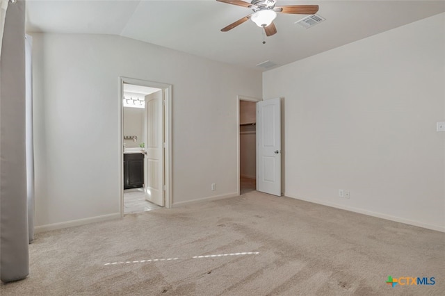 506 Old Peak Rd, Georgetown, TX 78626 - unfurnished bedroom with carpet floors, lofted ceiling, ensuite bath, a spacious closet, and baseboards