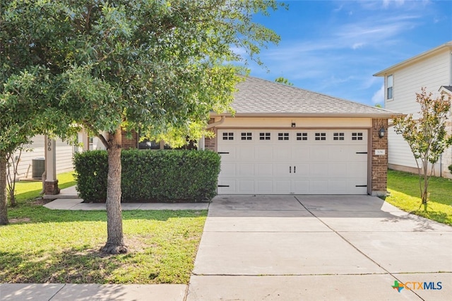 506 Old Peak Rd, Georgetown, TX 78626 - obstructed view of property with driveway, an attached garage, a front lawn, and roof with shingles