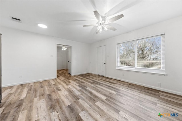 unfurnished room with ceiling fan and light hardwood / wood-style flooring