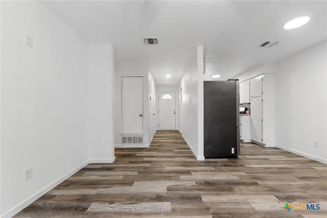 corridor featuring hardwood / wood-style floors