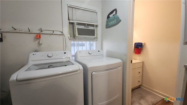 washroom with cooling unit, independent washer and dryer, and carpet flooring