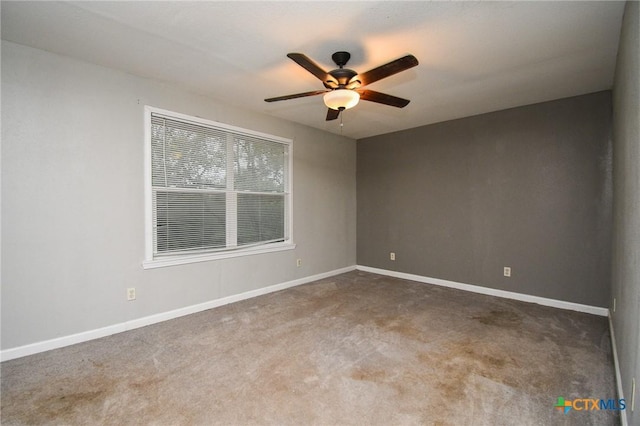 unfurnished room with carpet floors and ceiling fan