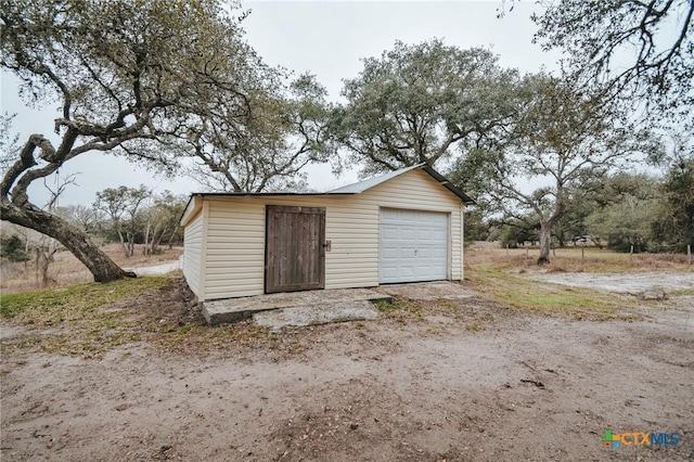 view of outdoor structure with a garage