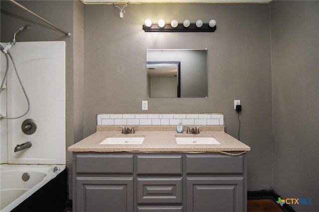 bathroom with bathtub / shower combination and vanity