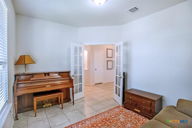 2502 Dante Ct, Harker Heights, TX 76548 - sitting room featuring french doors, healthy amount of natural light, and light tile patterned floors