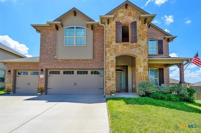 2502 Dante Ct, Harker Heights, TX 76548 - view of front facade featuring stone siding, a front yard, driveway, a garage, and brick siding