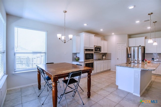 2502 Dante Ct, Harker Heights, TX 76548 - kitchen featuring stainless steel appliances, plenty of natural light, a chandelier, white cabinets, and recessed lighting
