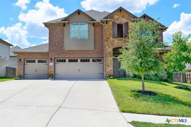 2502 Dante Ct, Harker Heights, TX 76548 - view of front of house featuring stone siding, driveway, an attached garage, and brick siding