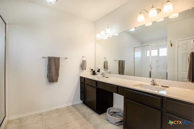 2502 Dante Ct, Harker Heights, TX 76548 - bathroom featuring double vanity, a stall shower, and tile patterned floors
