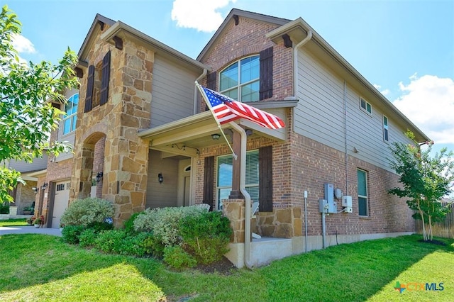 2502 Dante Ct, Harker Heights, TX 76548 - view of front of house with stone siding, a front lawn, and an attached garage