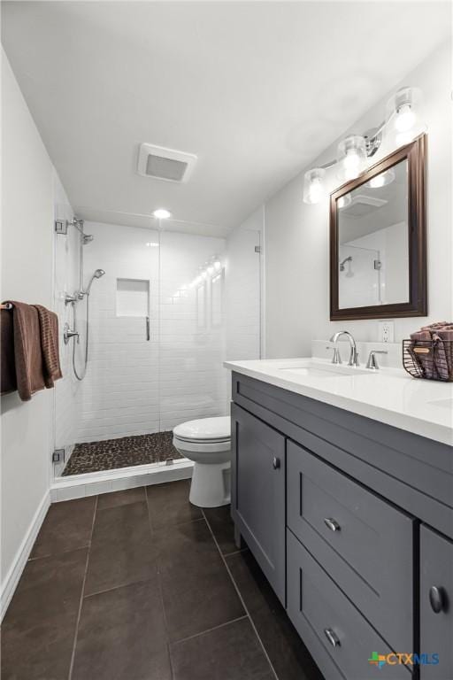 full bath with tile patterned flooring, a shower stall, toilet, and vanity