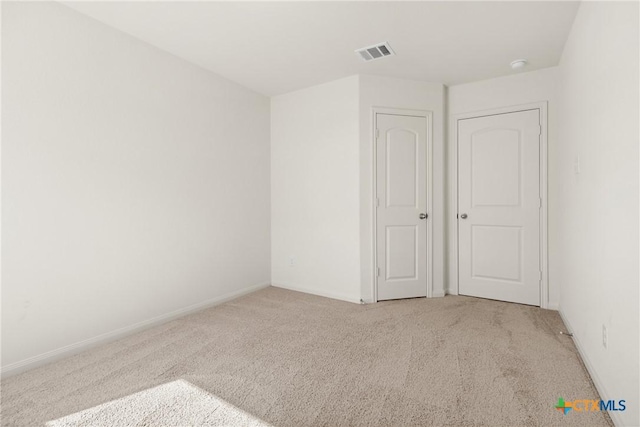 empty room with light carpet