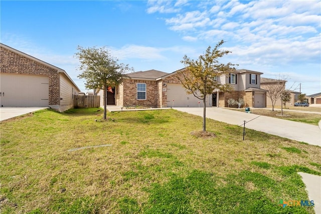 view of front of house with a garage and a front lawn