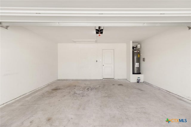 garage with a garage door opener and water heater