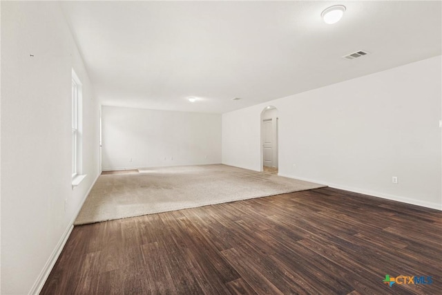 empty room with hardwood / wood-style flooring