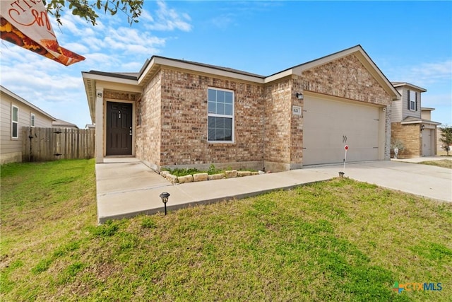 view of front of home with a garage and a front lawn