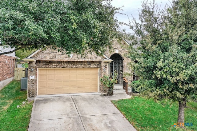 obstructed view of property with cooling unit and a garage