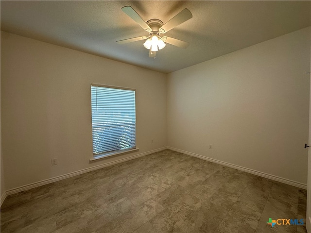 spare room with ceiling fan