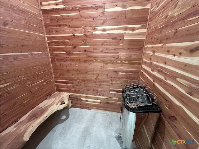 view of sauna featuring wooden walls