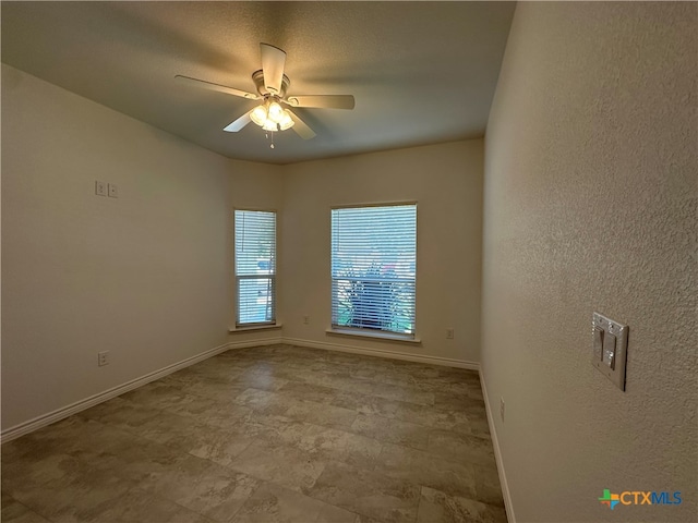 spare room featuring ceiling fan