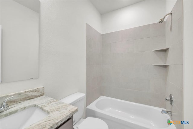 full bathroom featuring bathing tub / shower combination, vanity, and toilet